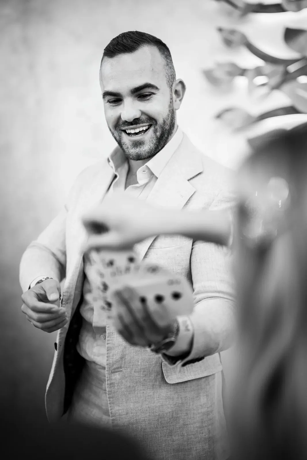 Matteo shuffling cards — black and white portrait