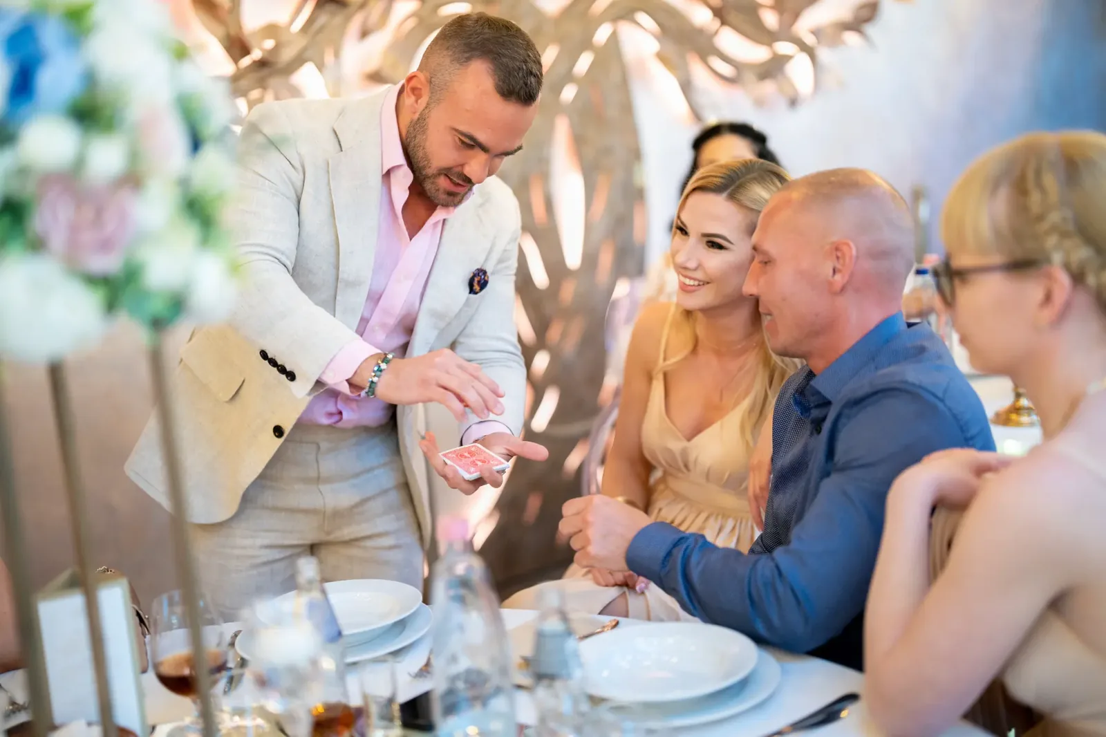 Matteo showing cards at decorated wedding dinner