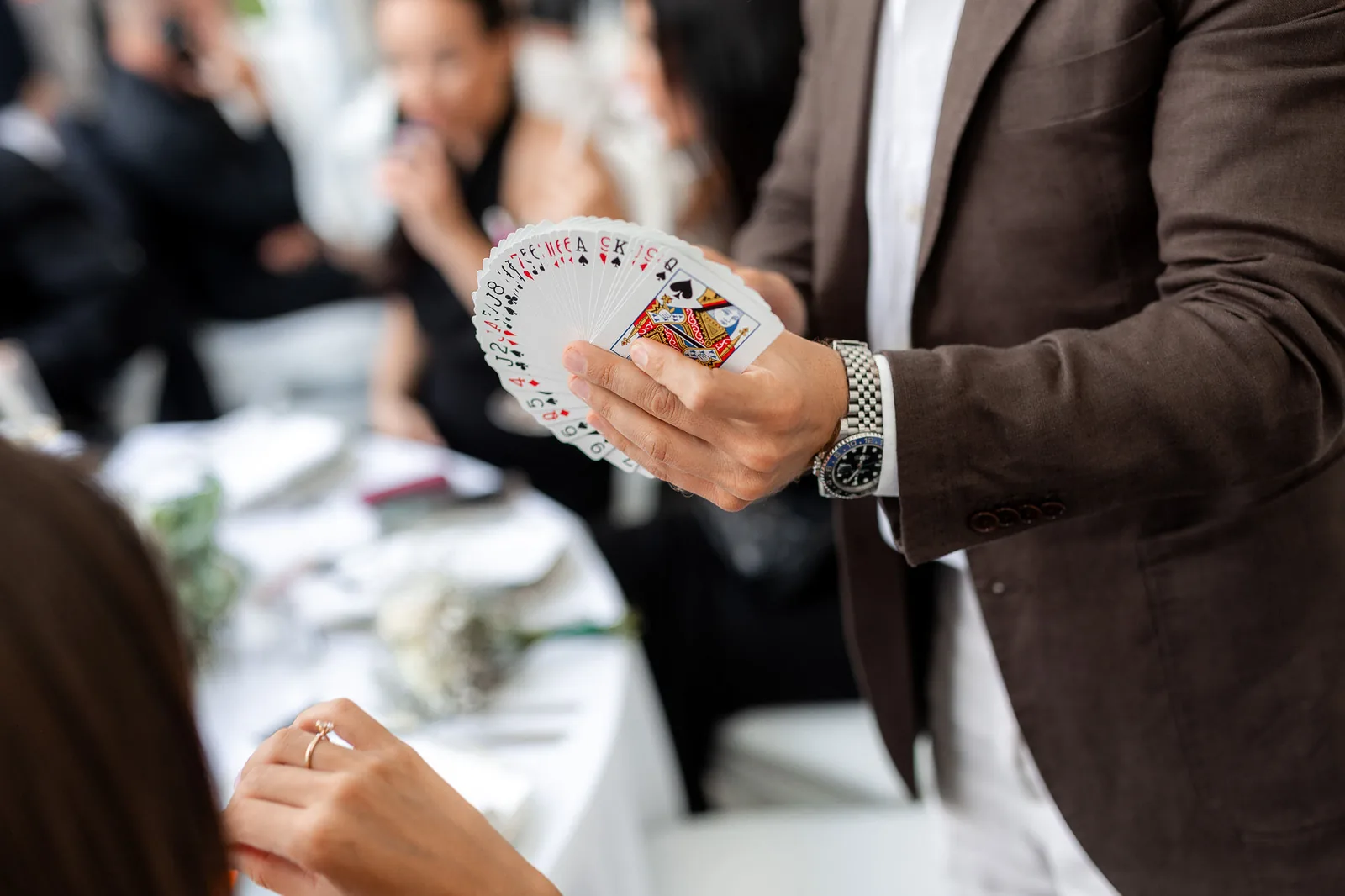 Card fan display at wedding reception table