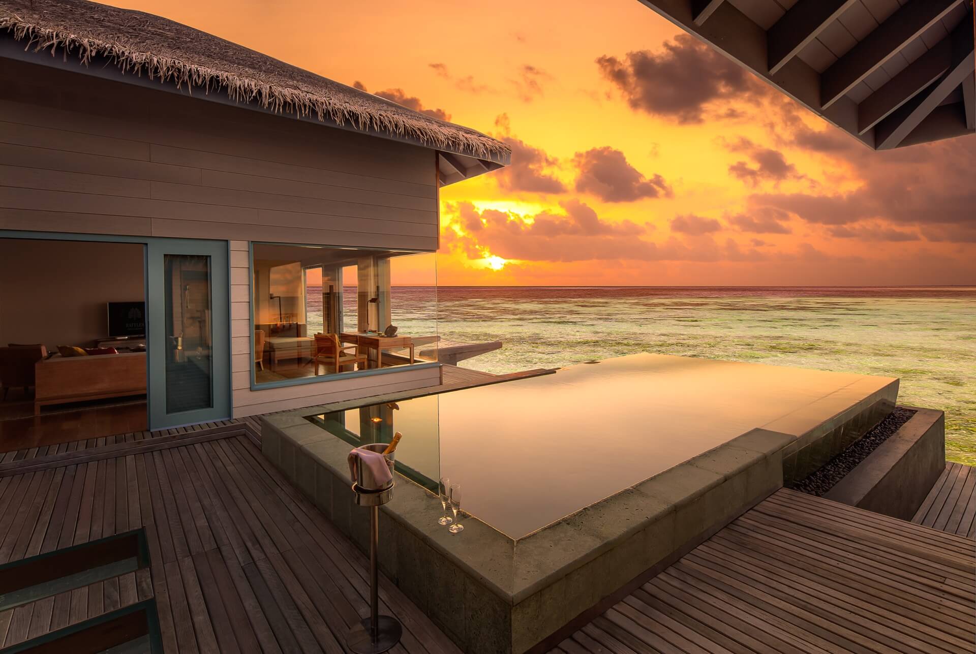 Luxury overwater villa at sunset — ideal collaboration partner