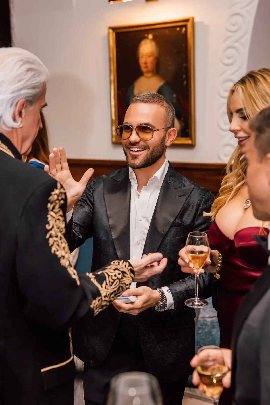 Guests reacting to close-up magic at a formal event