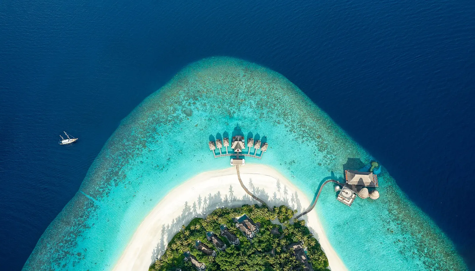 Aerial view of a luxury overwater resort in the Maldives