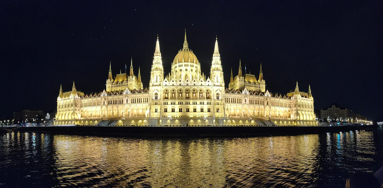 The Hungarian Parliament building illuminated at night on the Danube
