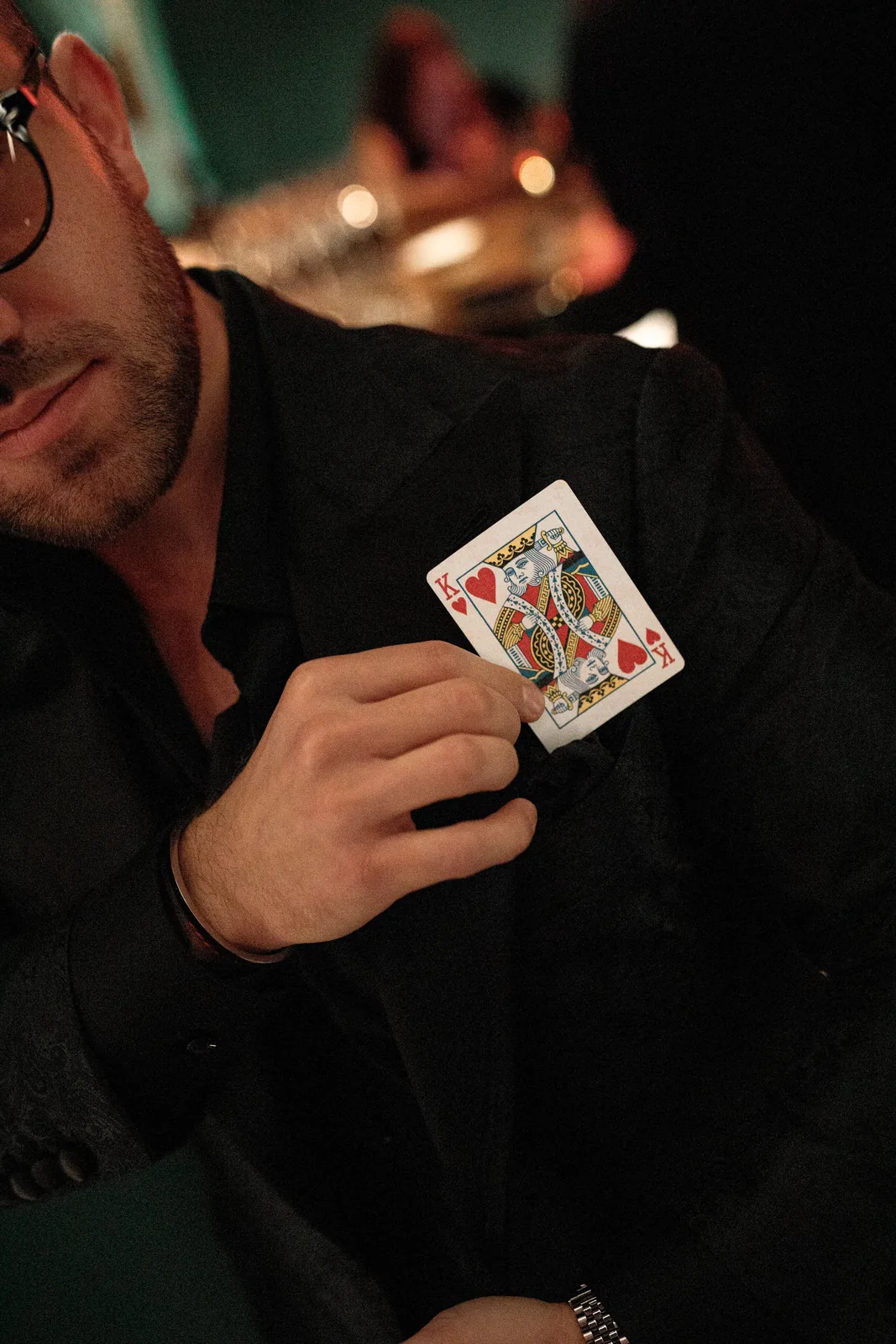 Matteo Cammisa revealing the King of Hearts from a guest's jacket at W Budapest